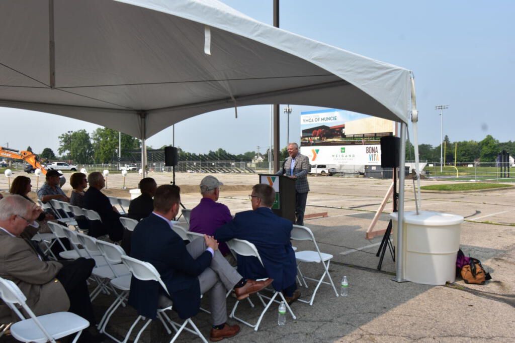 Larry Weigand giving a speech to event attendees.