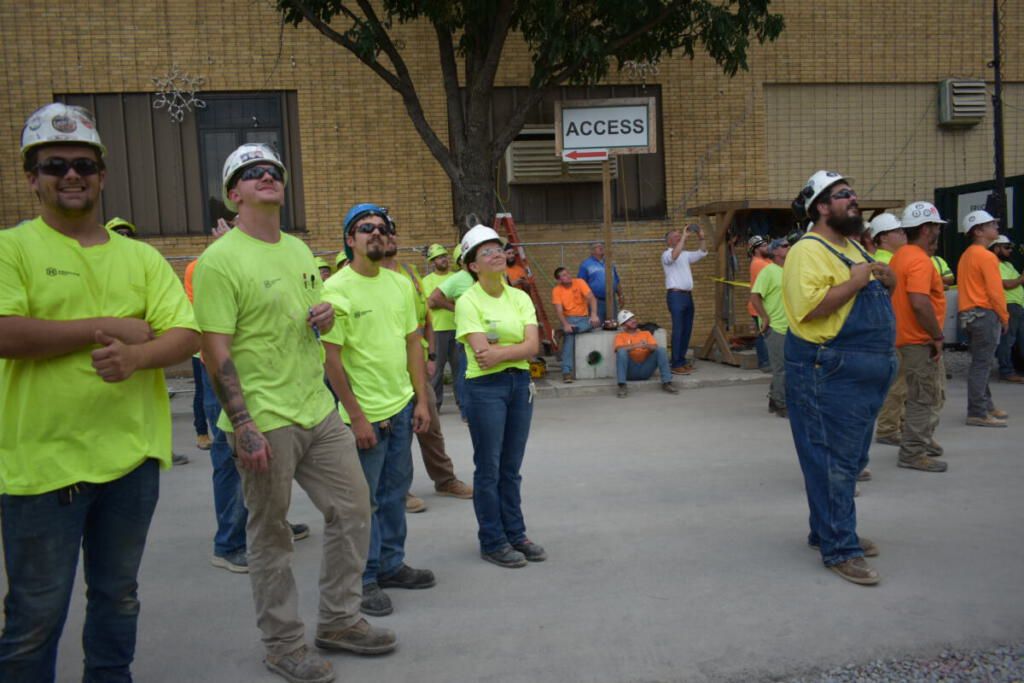 The crew looks on as the ceremony commences